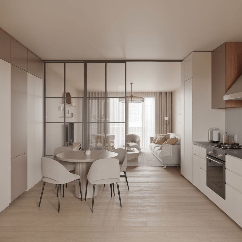 Cuisine ouverte et séjour modernes avec table ronde, quatre chaises, cloison vitrée et mobilier aux tons neutres. La lumière naturelle baigne l'espace grâce à de grandes fenêtres.